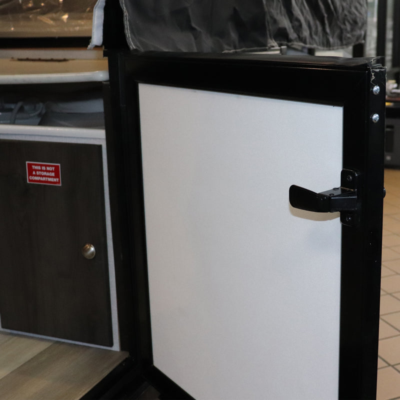 an installed black latch as viewed from the inside of the door