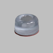 A clear rubber bumper dimple with a red base, designed for use as a bumper stop or awning rafter pole.