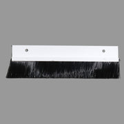 A black brush seal used for glide outs, with a metal backing plate and two mounting holes.