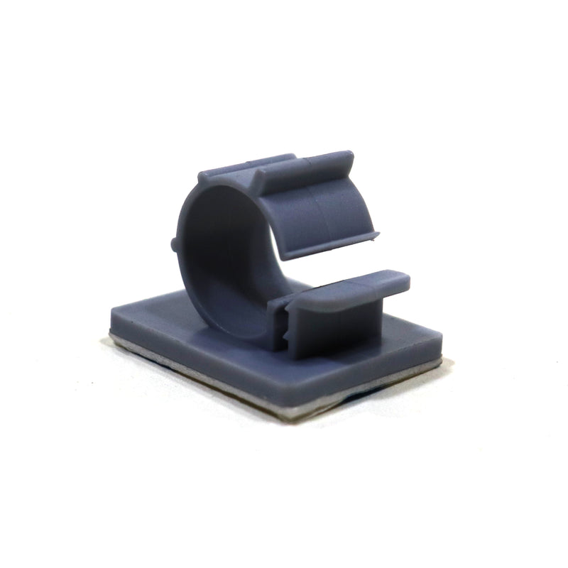 A gray adhesive cable clamp with a snap closure.