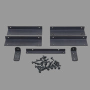 Assorted metal brackets and wood screws laid out on a gray surface.