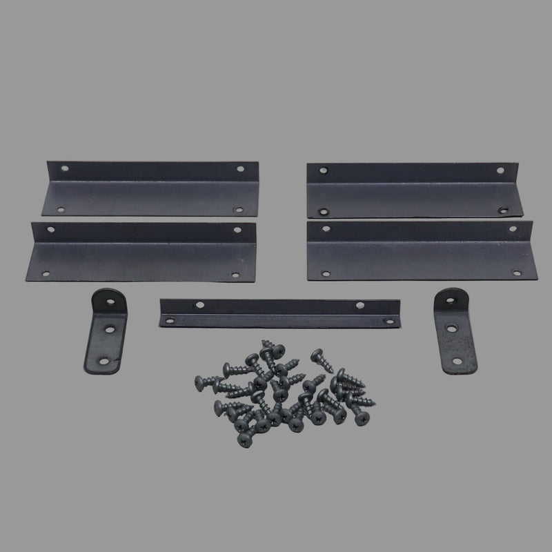 Assorted metal brackets and wood screws laid out on a gray surface.