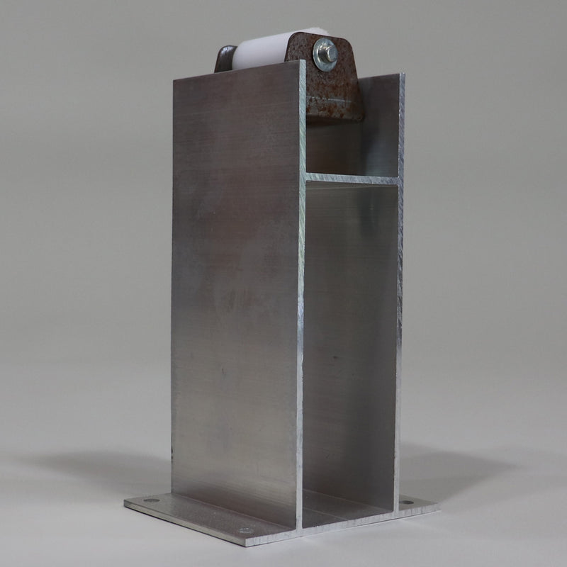 A silver roller tower found on larger Grand Tour and Highlander units, featuring a bracket and roller for the glide out system.