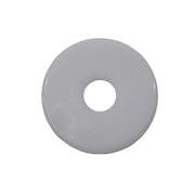 A white washer with a visible center hole, placed on a grey surface.