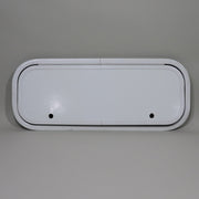 A white camper compartment door with two latch holes.
