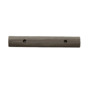 A beige awning adjuster handle lying on a flat surface.