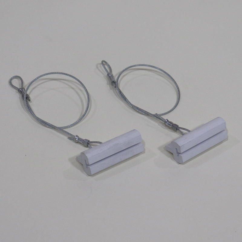 A set of white screen door track guides connected by a metal cable.