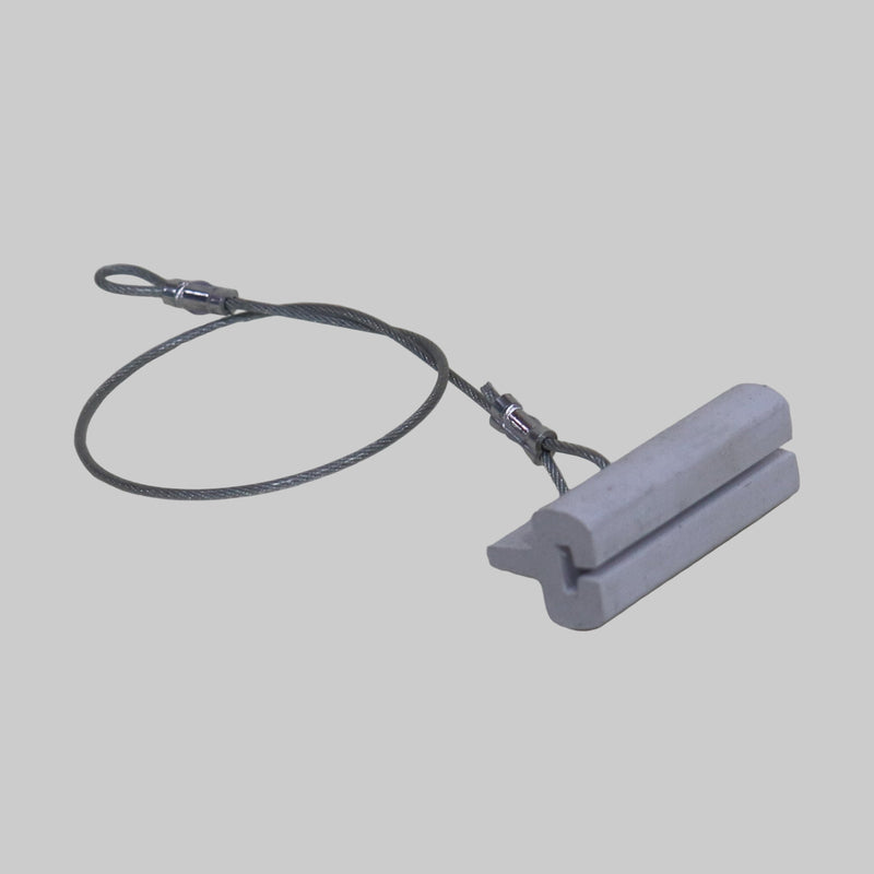 A set of white screen door track guides connected by a metal cable.