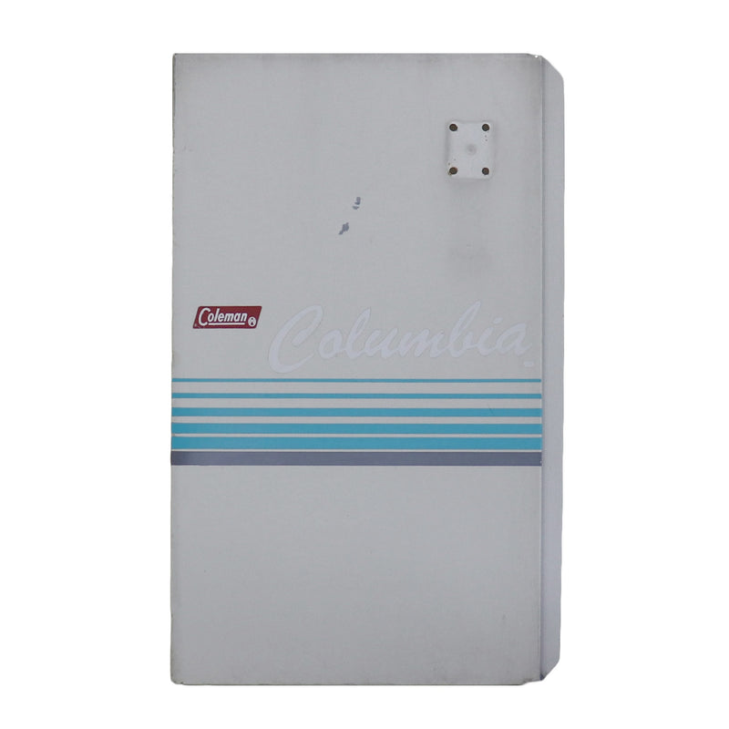 A used metal side panel from a 1980's Columbia vehicle, primarily white with blue and black accents and the Columbia brand logo.