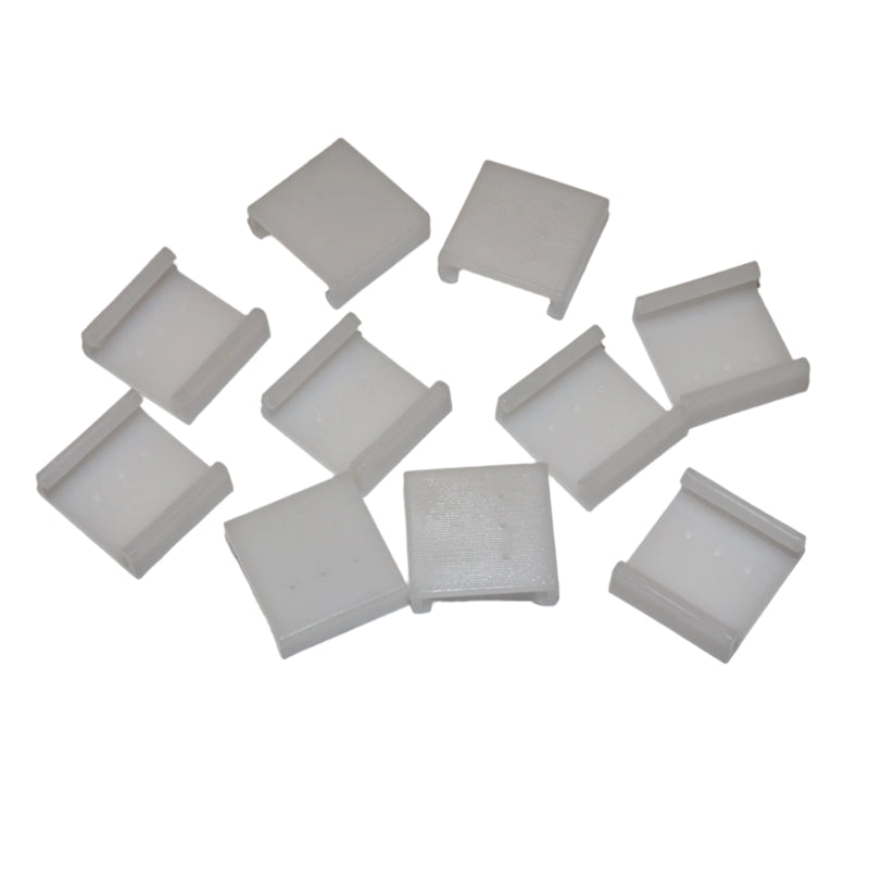 A set of 10 white plastic curtain clips laid out on a white surface.