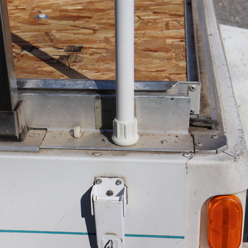 bottom of the roof support pole shown on the deck of a camper