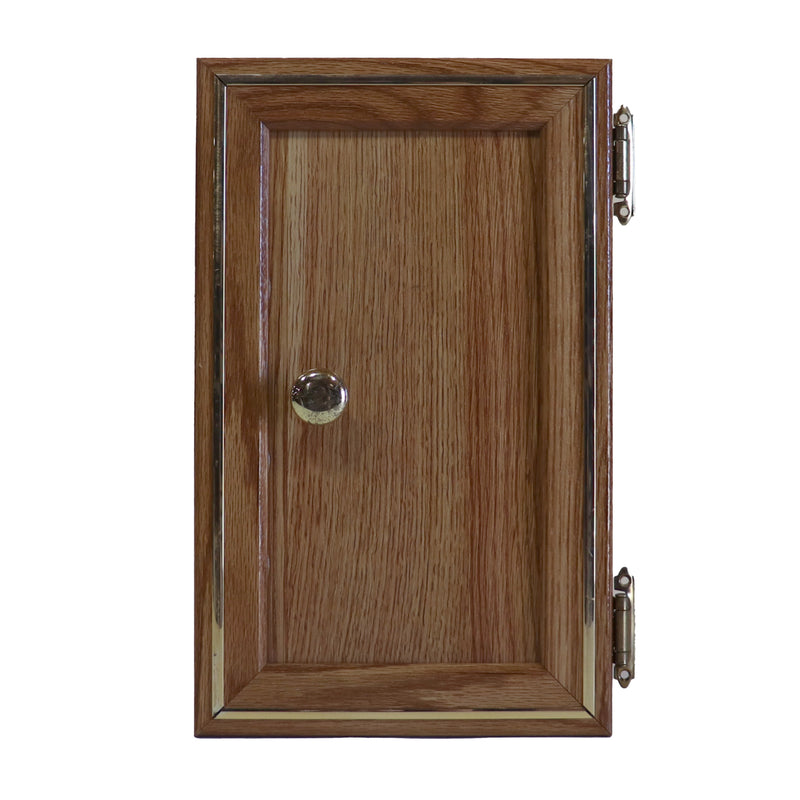 A wooden galley cabinet door with a metal handle and hinges, set against a plain background.