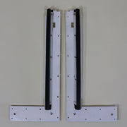 Two white stepper door bulkheads with mounting holes and seals, part of a motor vehicle's interior structure.