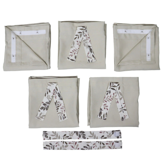 Set of folded camper curtains with leaf pattern on a dark background