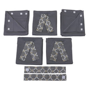 Set of gray folded pop up camper curtains with geometric pattern ties on a white background
