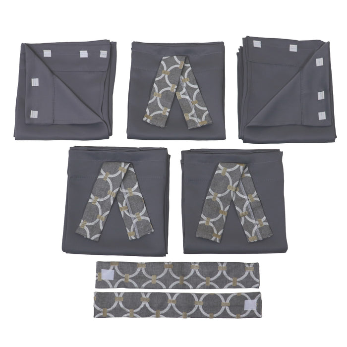 Set of gray folded pop up camper curtains with geometric pattern ties on a white background