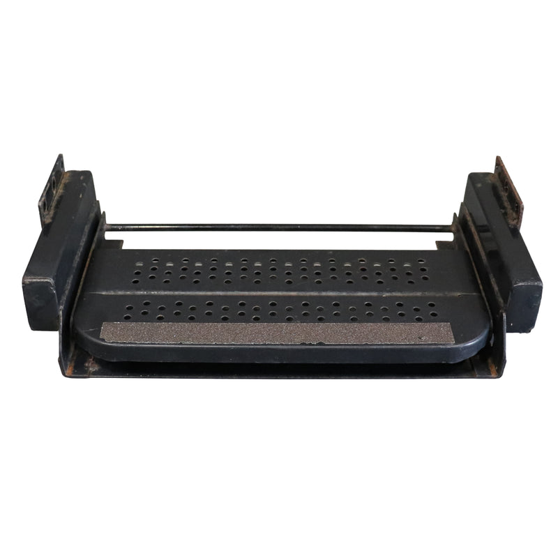 Black metal pull out step pan with perforations on a white background