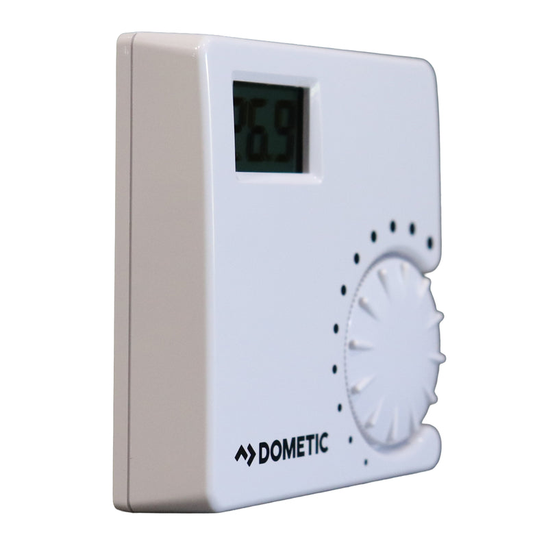 Digital thermostat with a dial and digital display on a white background, featuring the Dometic brand.