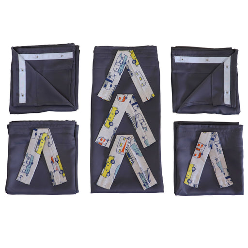 Set of folded curtains with vehicle pattern ties on a white background