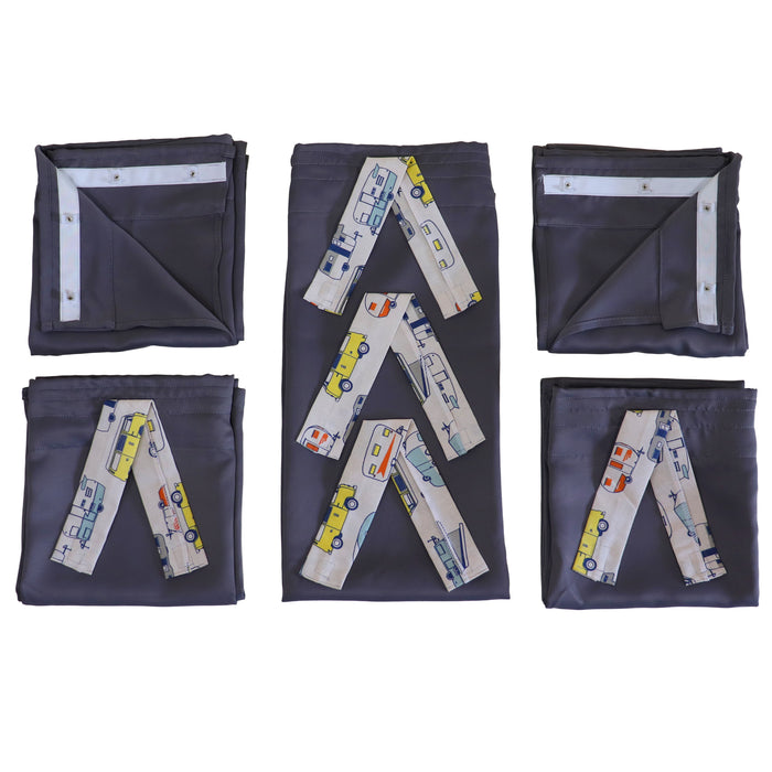 Set of folded curtains with vehicle pattern ties on a white background