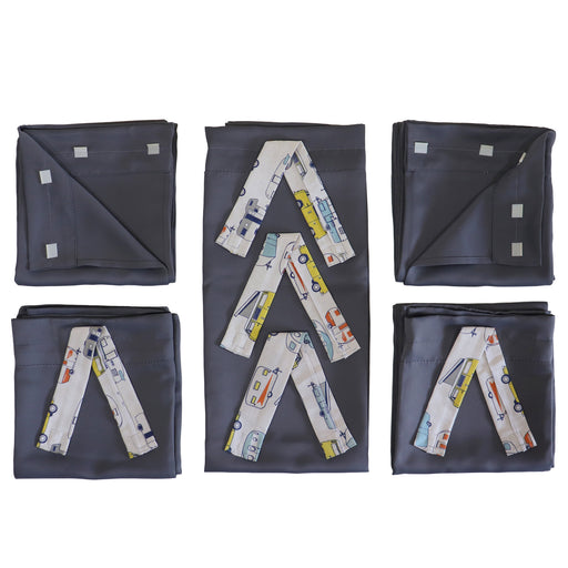 set of folded pop up camper curtains with vehicle pattern ties