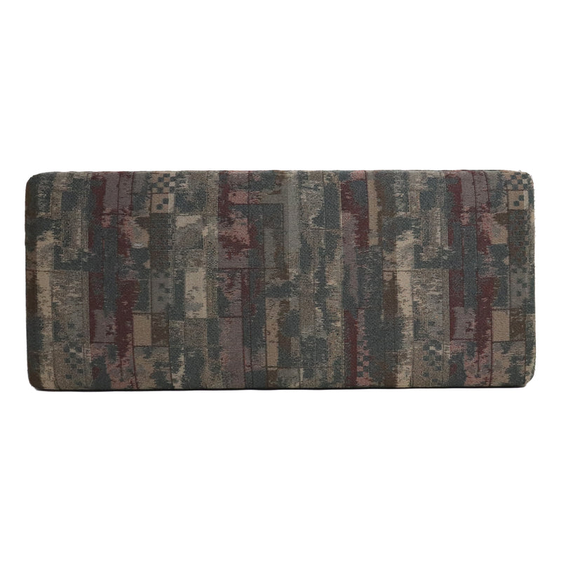 Patterned sofa cushion with multicolor design on a white background