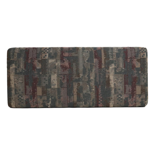 Patterned sofa cushion with multicolor design on a white background