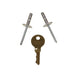Two metal rivets and a 1101x key on a white background