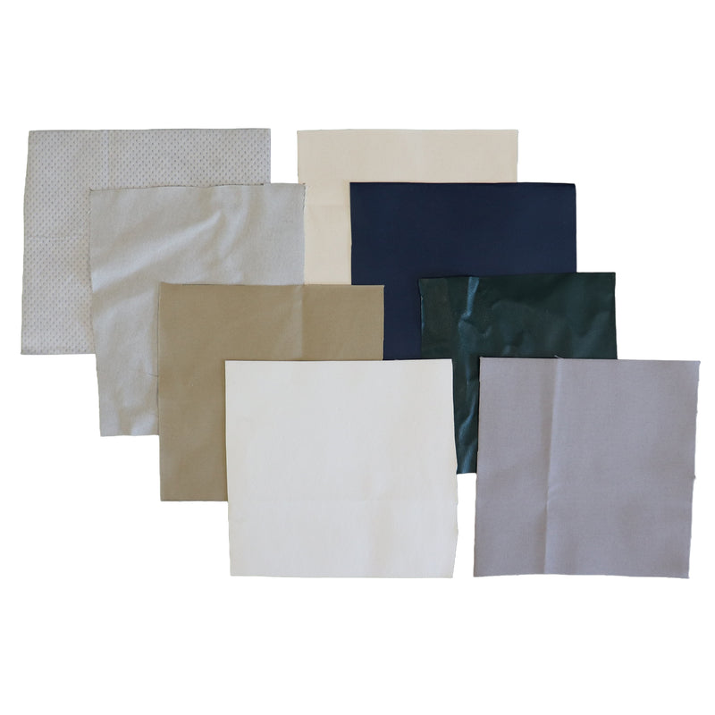 A set of eight square patches  in various colors and textures, arranged in a fan-like layout on a solid white background. The colors include white, light gray, beige, navy blue, and dark green.