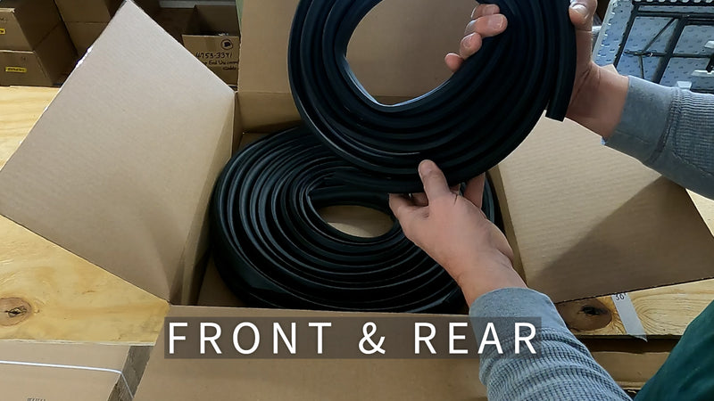 Person holding a roll of black material with 'Front & Rear' text overlay in a warehouse setting.