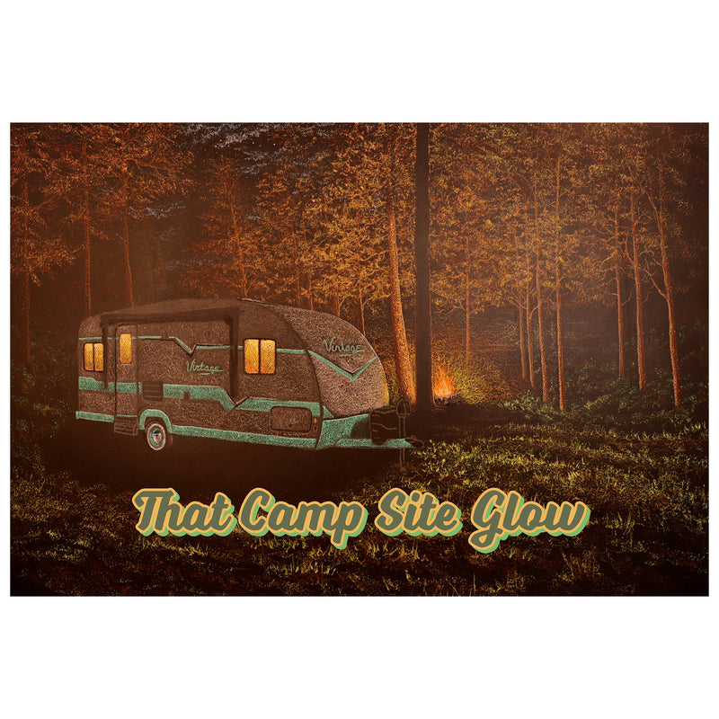 A decal featuring a camper trailer in a forest setting with a glowing light, and the text 'That Camp Site GLOW'.