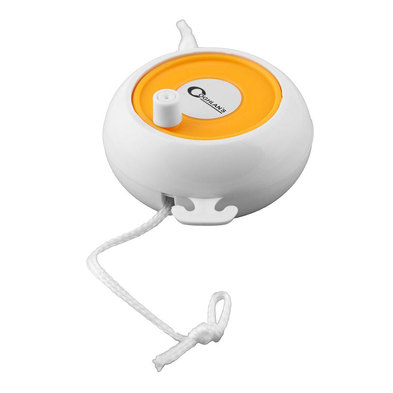 White and orange reel with a cord on a white background