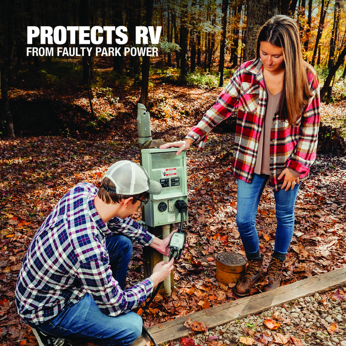 couple at a campground plugging in the power cord to the surge protector