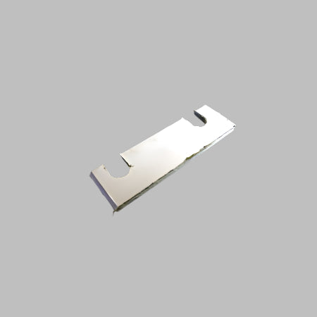 A silver-colored metal latch strike shim against a black background.
