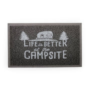 A gray rectangular door mat with the text 'Life is better at the campsite' printed in the center, featuring an illustration of a camping trailer and trees.