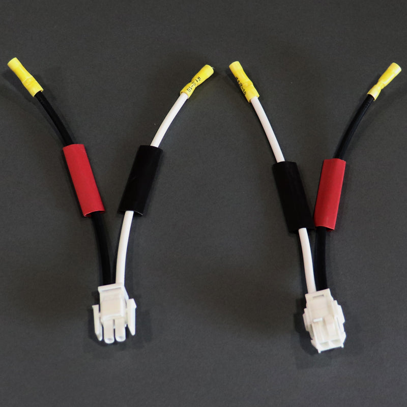 A set of battery harness repair kit components with red and black coloring and yellow connectors.