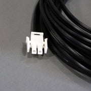 A black auto extension battery harness showing the battery connection 