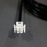 A black auto extension battery harness with red and yellow alligator clips and a white connector.