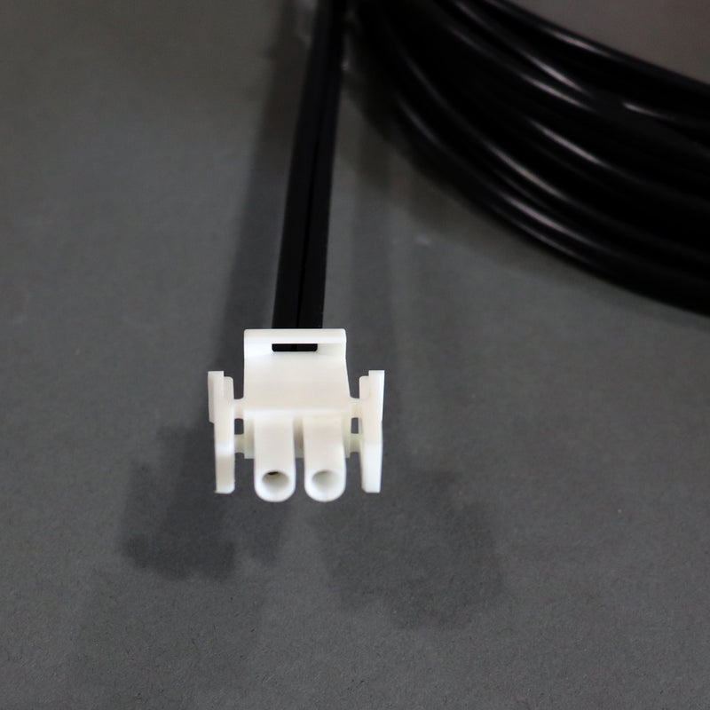 A black auto extension battery harness with red and yellow alligator clips and a white connector.
