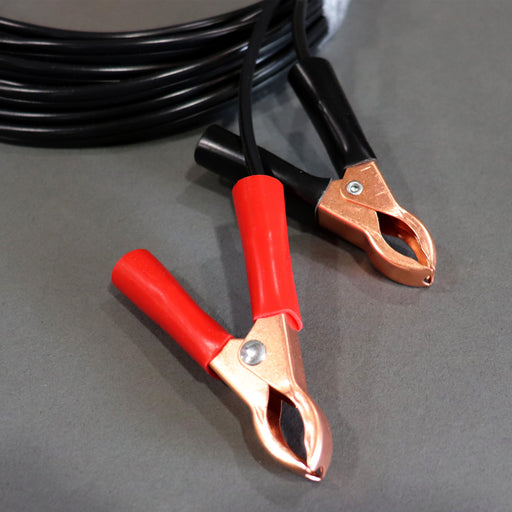 A black auto extension battery harness with red and yellow alligator clips and a white connector.