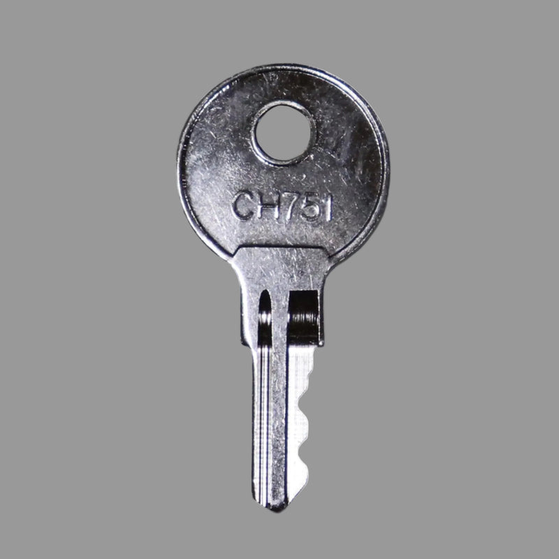 A silver metal key with 'CH751' engraved on the head.