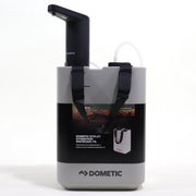 A Dometic water jug and USB powered faucet set, including mounting bases, a USB cable, and other accessories, displayed on a white surface.