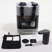 A Dometic water jug and USB powered faucet set, including mounting bases, a USB cable, and other accessories, displayed on a white surface.