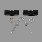 Two black latches with accompanying silver rivets and washers laid out on a grey surface.