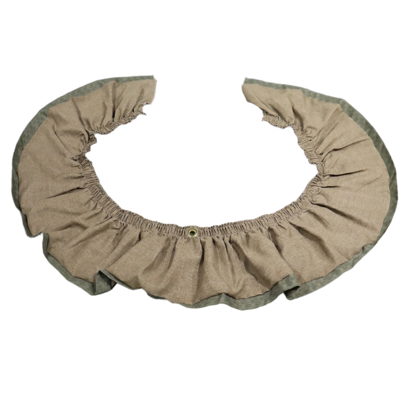 A beige and green colored valance with a ruffled design and a central grommet, displayed on a flat surface.