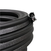 A roll of black ABS roof seal with adhesive side visible, against a grey background.