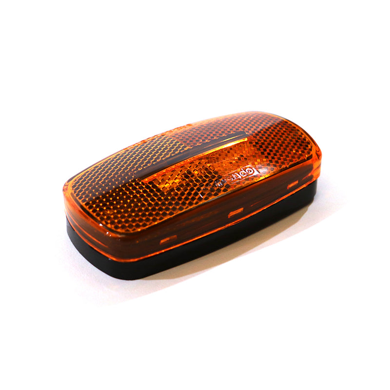 An oval-shaped LED amber marker lamp with a white base, designed for vehicle running lights.