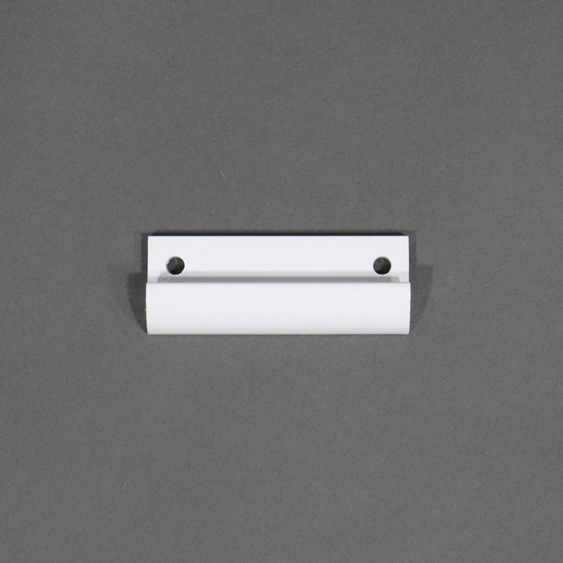A metal roof latch strike for a camper, painted in white color, with visible mounting holes.