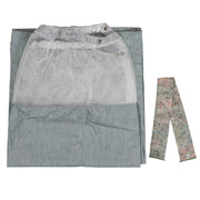 A light green dressing room curtain with white mesh top and a curtain tie, laid flat on a gray surface.
