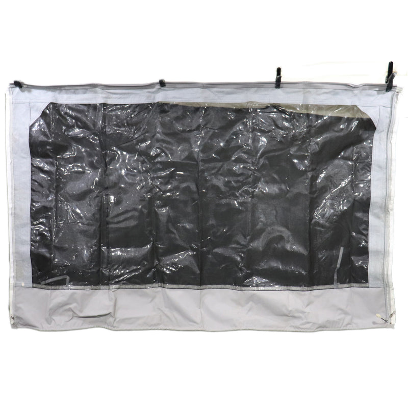 A large canvas window for a coleman pop-up camper, grey in color with black window backing